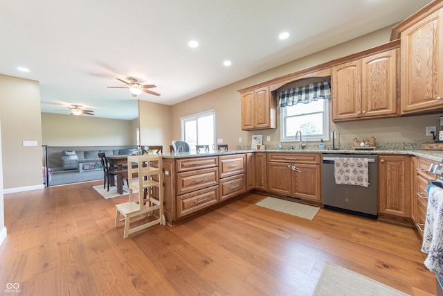 8090 N State Highway 7, Elizabethtown, IN 47232 - kitchen with stainless steel dishwasher, a peninsula, light wood finished floors, light stone countertops, and a ceiling fan