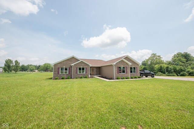 8090 N State Highway 7, Elizabethtown, IN 47232 - single story home featuring a front lawn and brick siding