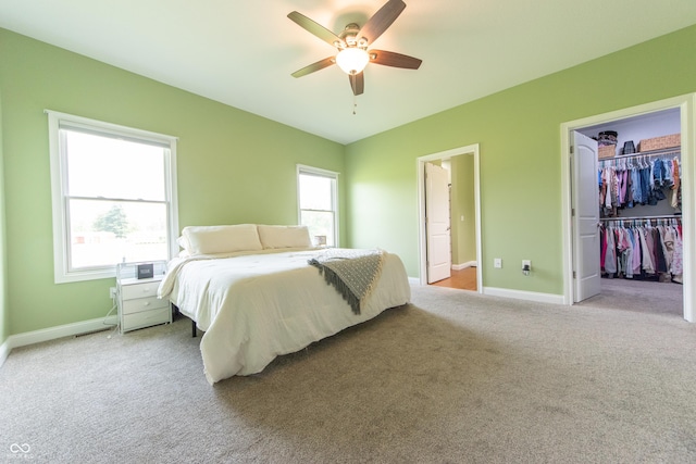 8090 N State Highway 7, Elizabethtown, IN 47232 - bedroom with light carpet, a ceiling fan, and a walk in closet