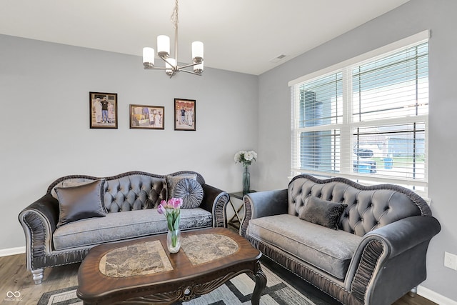 5812 Flat Hill Dr, Indianapolis, IN 46239 - living room with wood finished floors and a chandelier