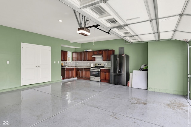 5812 Flat Hill Dr, Indianapolis, IN 46239 - garage featuring freestanding refrigerator and a garage door opener