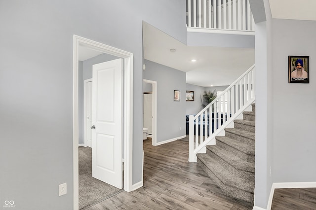5812 Flat Hill Dr, Indianapolis, IN 46239 - stairs with baseboards and wood finished floors