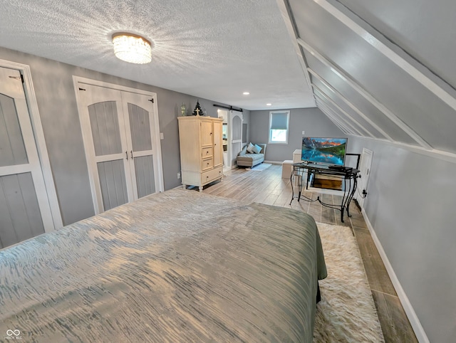 308 W Jefferson St, Kirklin, IN 46050 - bedroom featuring wood finished floors and a textured ceiling