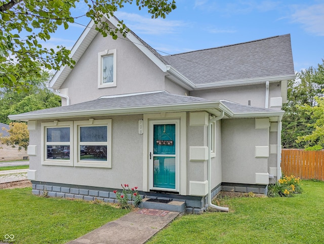 308 W Jefferson St, Kirklin, IN 46050 - view of front facade with a shingled roof and stucco siding