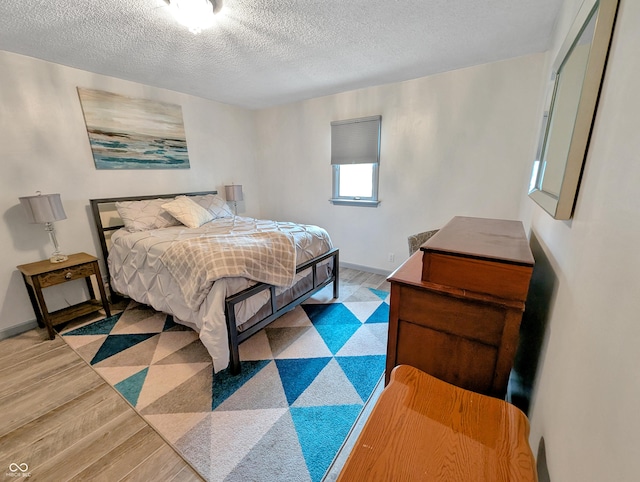 308 W Jefferson St, Kirklin, IN 46050 - bedroom with a textured ceiling and light wood-type flooring