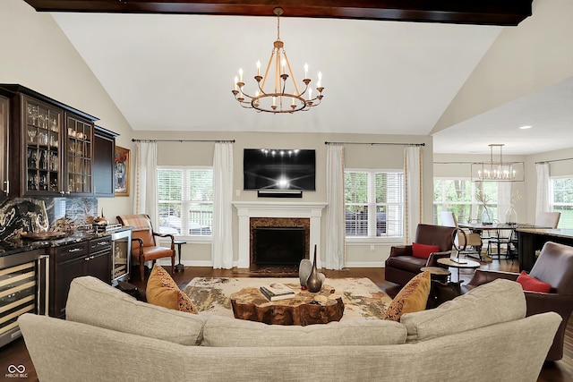 15410 Mission Hills Dr, Carmel, IN 46033 - living area with a chandelier, beverage cooler, dark wood-type flooring, a fireplace, and high vaulted ceiling