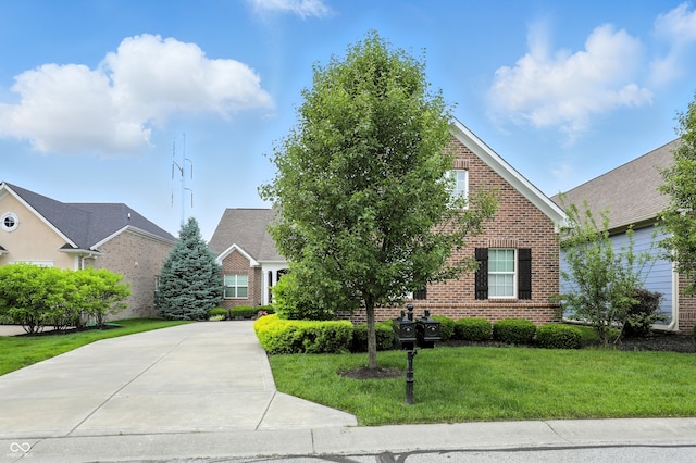 15410 Mission Hills Dr, Carmel, IN 46033 - view of front of property with brick siding, a front yard, and driveway
