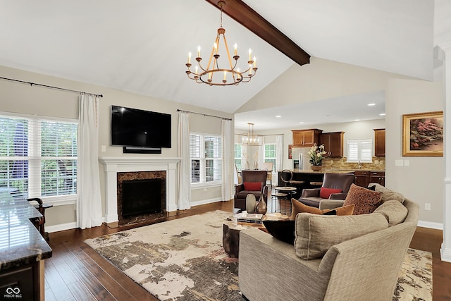 15410 Mission Hills Dr, Carmel, IN 46033 - living area with a chandelier, a fireplace, dark wood-style floors, and plenty of natural light