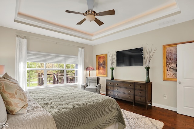 15410 Mission Hills Dr, Carmel, IN 46033 - bedroom featuring a raised ceiling, wood finished floors, and ceiling fan