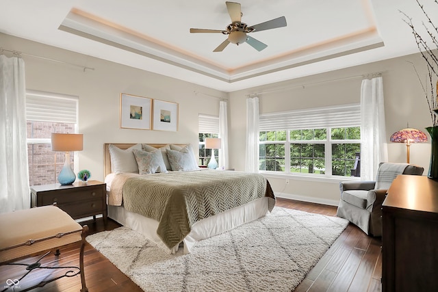 15410 Mission Hills Dr, Carmel, IN 46033 - bedroom with a tray ceiling, wood finished floors, and a ceiling fan