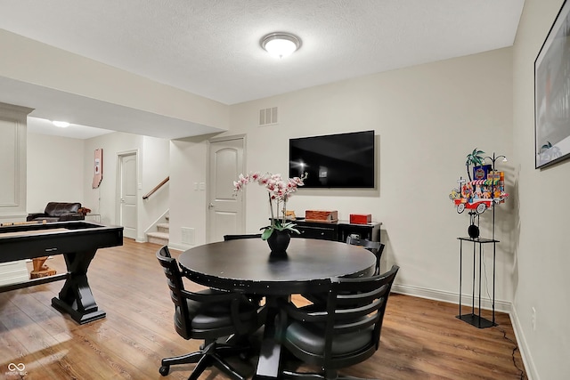 15410 Mission Hills Dr, Carmel, IN 46033 - dining space with wood finished floors and stairway