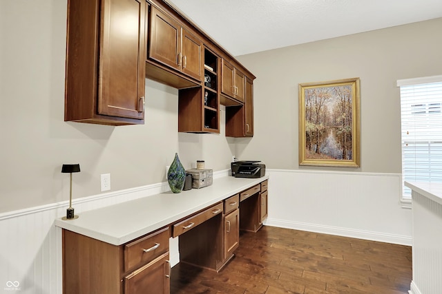 15410 Mission Hills Dr, Carmel, IN 46033 - home office with built in desk, wainscoting, dark wood-type flooring, and plenty of natural light