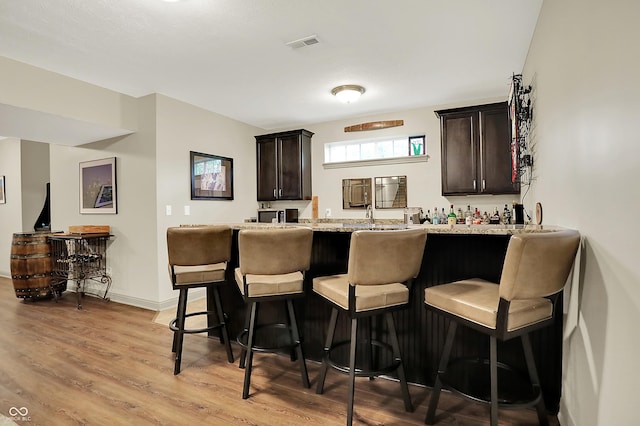 15410 Mission Hills Dr, Carmel, IN 46033 - indoor bar with light wood-style floors and baseboards