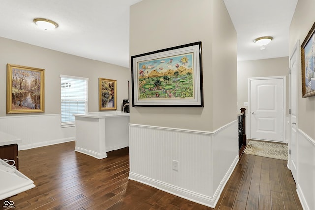 15410 Mission Hills Dr, Carmel, IN 46033 - hall with wainscoting and dark wood-style flooring