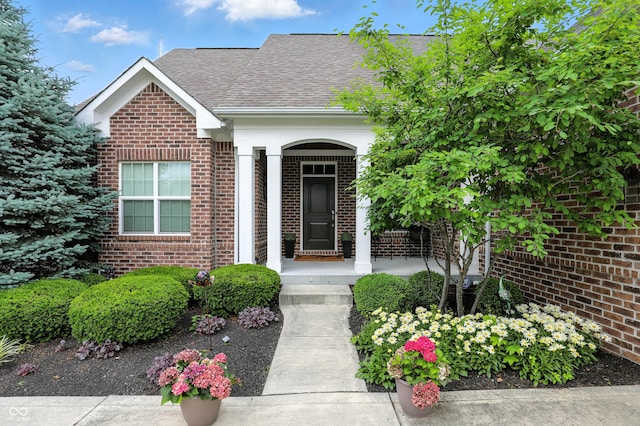 15410 Mission Hills Dr, Carmel, IN 46033 - property entrance with brick siding and a shingled roof