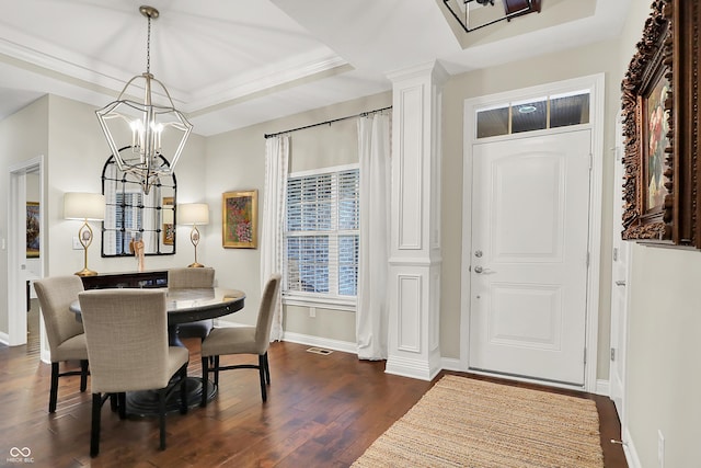 15410 Mission Hills Dr, Carmel, IN 46033 - dining area featuring a tray ceiling, a chandelier, dark wood finished floors, and crown molding