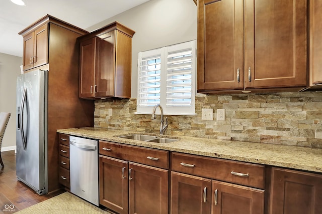 15410 Mission Hills Dr, Carmel, IN 46033 - kitchen featuring appliances with stainless steel finishes, dark wood-type flooring, light stone counters, and tasteful backsplash