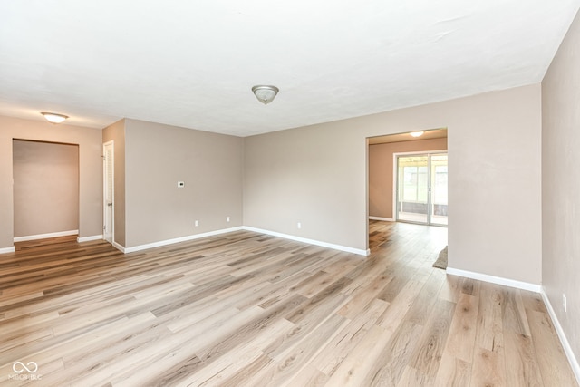823 Rustic Rd, Anderson, IN 46013 - empty room featuring baseboards and light wood-style floors