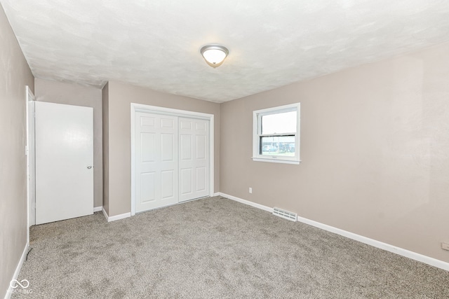 823 Rustic Rd, Anderson, IN 46013 - unfurnished bedroom featuring carpet flooring and a closet