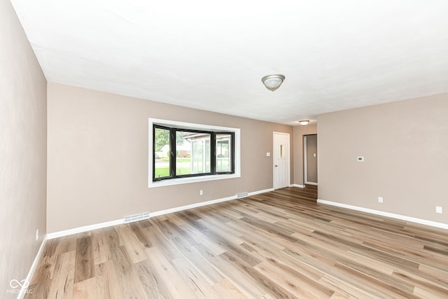 823 Rustic Rd, Anderson, IN 46013 - unfurnished room featuring light wood-style floors and baseboards