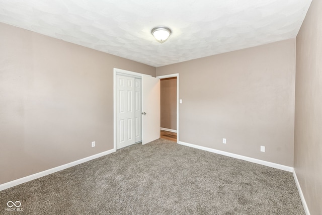 823 Rustic Rd, Anderson, IN 46013 - carpeted empty room featuring baseboards