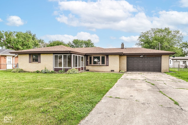 823 Rustic Rd, Anderson, IN 46013 - ranch-style home with brick siding, a garage, driveway, and a sunroom