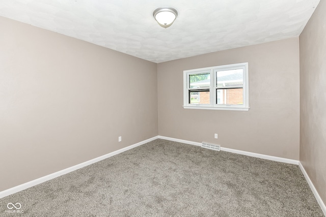 823 Rustic Rd, Anderson, IN 46013 - empty room with carpet floors and baseboards
