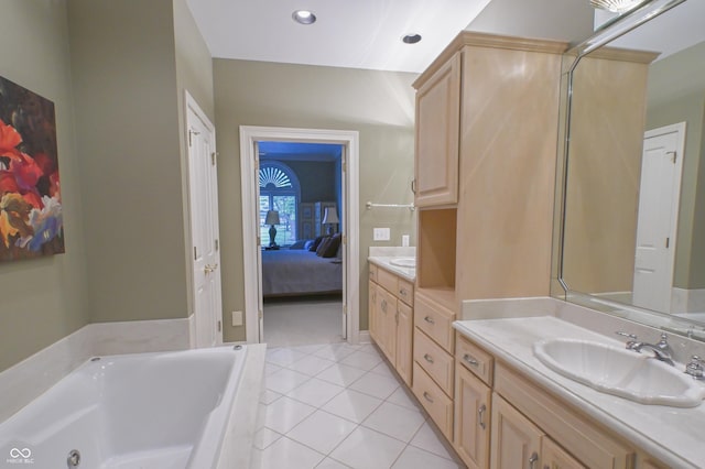 1870 Broadleaf Ct Unit 10, Greenwood, IN 46143 - bathroom featuring vanity, a tub with jets, tile patterned floors, ensuite bath, and recessed lighting