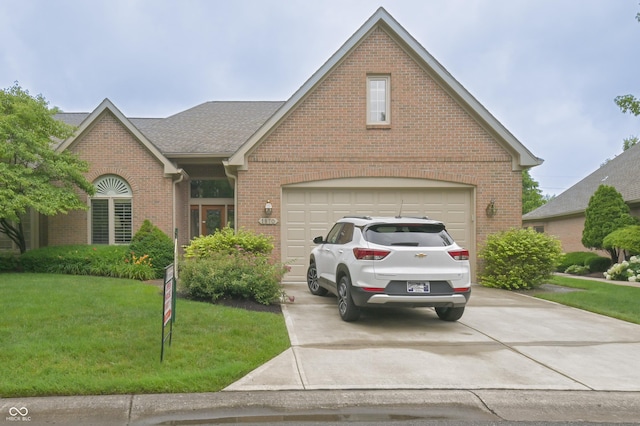1870 Broadleaf Ct Unit 10, Greenwood, IN 46143 - traditional-style house with brick siding, concrete driveway, a front lawn, roof with shingles, and an attached garage