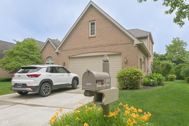 1870 Broadleaf Ct Unit 10, Greenwood, IN 46143 - view of side of home featuring brick siding, concrete driveway, a yard, an attached garage, and roof with shingles