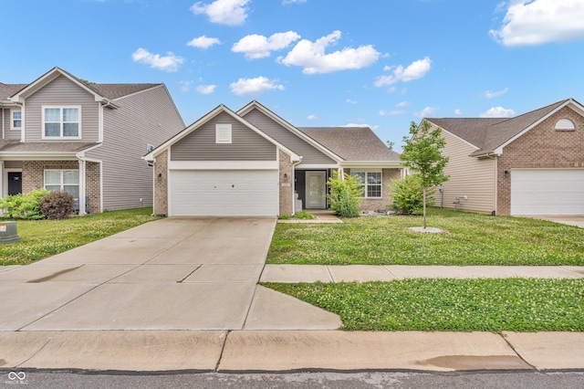 1181 S Aberdeen Dr, Franklin, IN 46131 - view of front of house featuring brick siding, an attached garage, a front lawn, and driveway