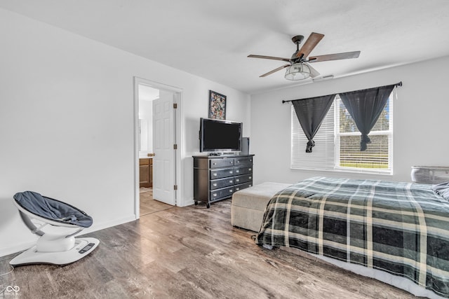 1181 S Aberdeen Dr, Franklin, IN 46131 - bedroom featuring wood finished floors, ensuite bathroom, and a ceiling fan