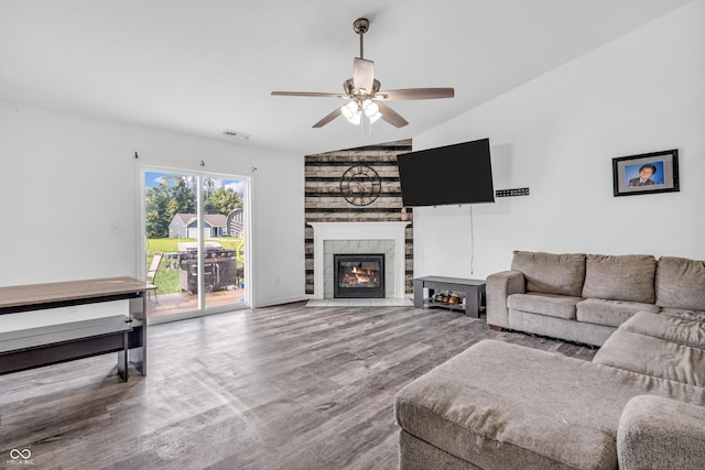 1181 S Aberdeen Dr, Franklin, IN 46131 - living room featuring vaulted ceiling, a ceiling fan, a fireplace, and wood finished floors