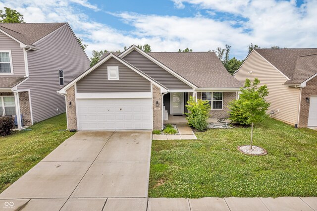 1181 S Aberdeen Dr, Franklin, IN 46131 - view of front of house featuring brick siding, an attached garage, and a front yard