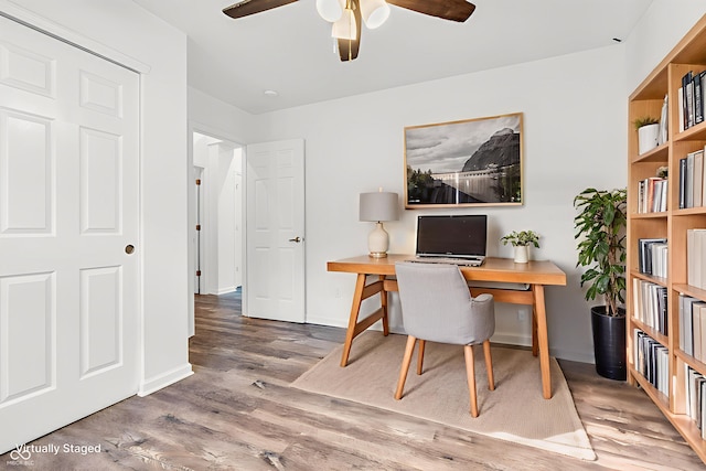 1181 S Aberdeen Dr, Franklin, IN 46131 - home office featuring a ceiling fan and wood finished floors