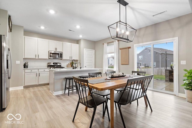 8547 Winton Pl, Pendleton, IN 46064 - dining space with light wood-style floors, recessed lighting, and a chandelier