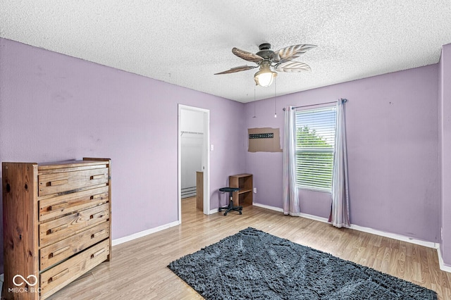 6259 Teacup Dr, Indianapolis, IN 46235 - bedroom with wood finished floors, a textured ceiling, and ceiling fan