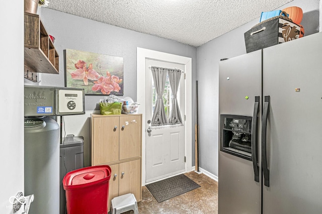 6259 Teacup Dr, Indianapolis, IN 46235 - kitchen with stainless steel fridge with ice dispenser, a textured ceiling, and light brown cabinetry