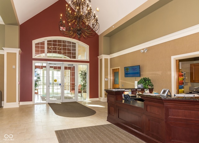 15946 Marsala Dr, Fishers, IN 46037 - reception featuring high vaulted ceiling, a chandelier, and french doors