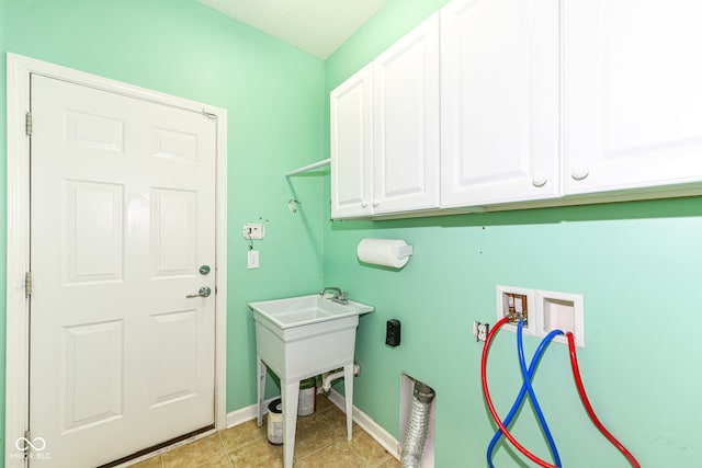 15946 Marsala Dr, Fishers, IN 46037 - laundry room with washer hookup, cabinet space, light tile patterned floors, and hookup for an electric dryer