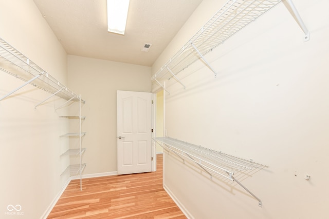 15946 Marsala Dr, Fishers, IN 46037 - spacious closet with light wood-style flooring
