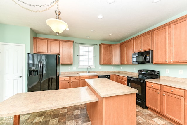 15946 Marsala Dr, Fishers, IN 46037 - kitchen with black appliances, light countertops, a kitchen island, recessed lighting, and decorative light fixtures