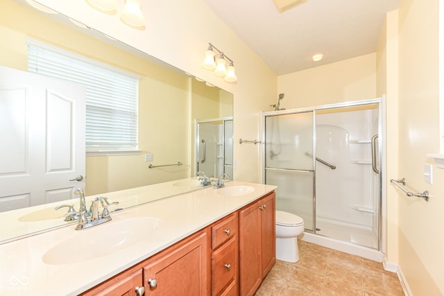15946 Marsala Dr, Fishers, IN 46037 - bathroom featuring a shower stall, double vanity, and tile patterned flooring
