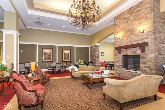 15946 Marsala Dr, Fishers, IN 46037 - living room with ornate columns, a chandelier, recessed lighting, a fireplace, and a raised ceiling