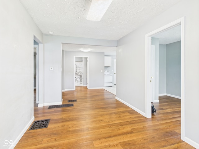4025 Main St, Anderson, IN 46013 - corridor featuring light wood finished floors and a textured ceiling