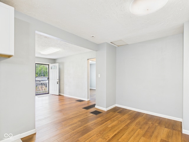 4025 Main St, Anderson, IN 46013 - unfurnished room with a textured ceiling and wood finished floors