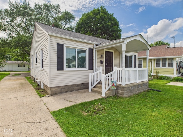 4025 Main St, Anderson, IN 46013 - view of front facade featuring a front lawn and a shingled roof