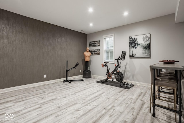 12505 Branford St, Carmel, IN 46032 - workout room featuring wood finished floors, recessed lighting, and an accent wall