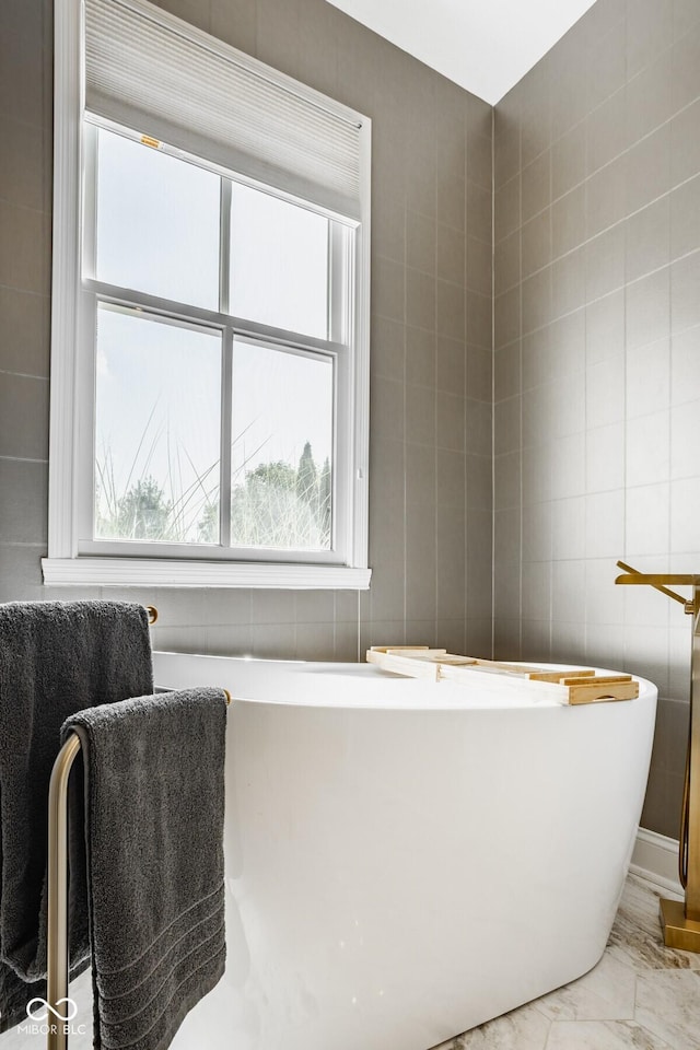 12505 Branford St, Carmel, IN 46032 - full bath featuring a soaking tub and marble finish floors