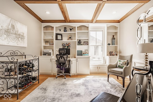 12505 Branford St, Carmel, IN 46032 - office area featuring built in desk, light wood-style floors, ornamental molding, coffered ceiling, and built in shelves